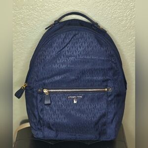 Michael Kors Navy Blue Backpack with gold zipper, unisex